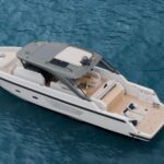 Bluegame 54 luxury yacht aerial port view, showcasing innovative walkaround deck design and elegant profile